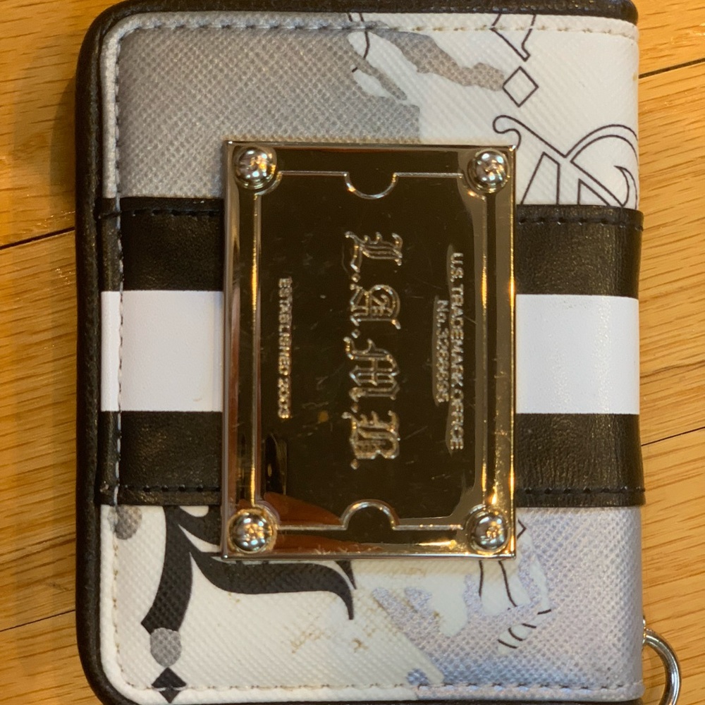 L.A.M.B. black and white leather wallet.